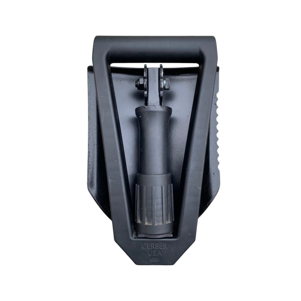 Pelle pliante Gerber US Army, lame et manche noir, attachment et mécanisme de serrage visibles, vue frontale.