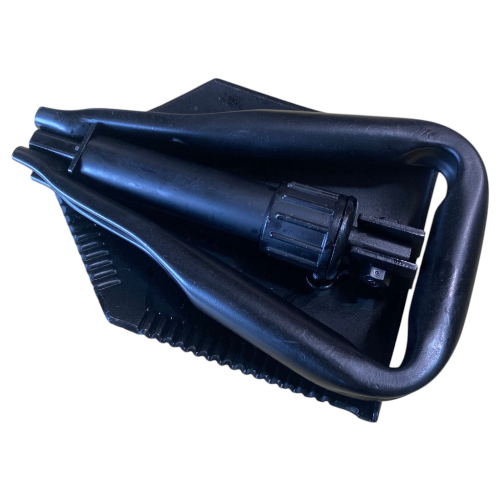 Pelle militaire pliante US Army authentique—poignée et lame pliables noires en plastique, avec mécanisme de verrouillage.