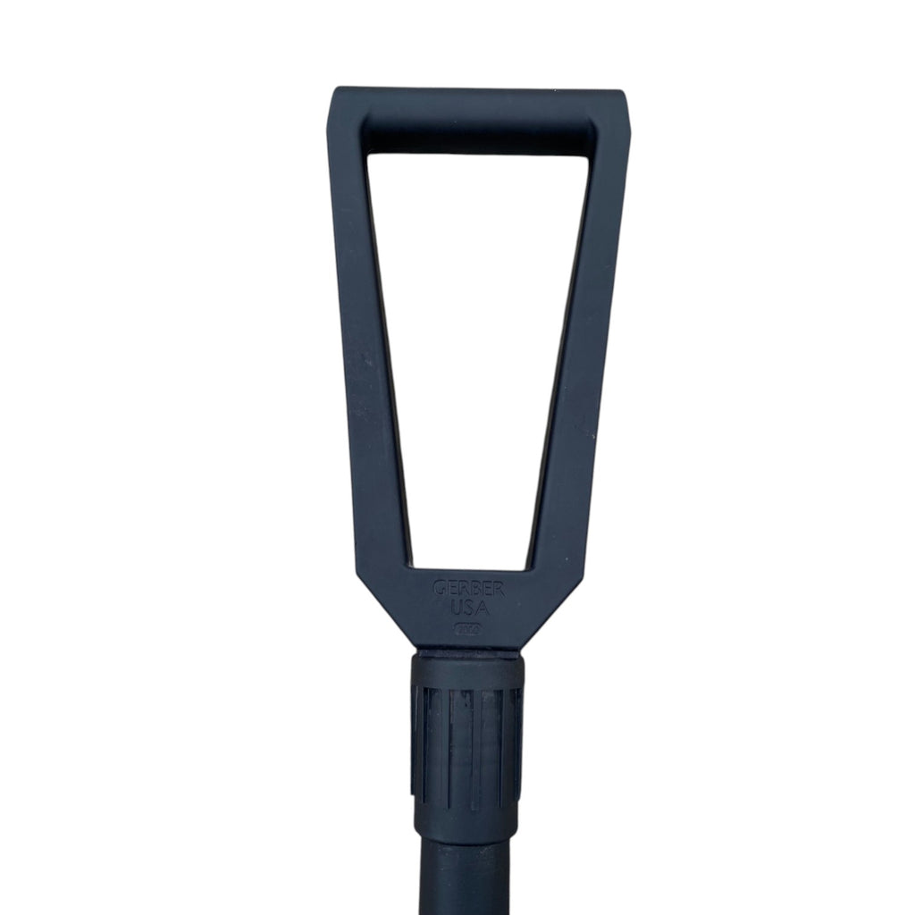Pelle pliante noire Gerber US Army, outil de survie militaire, manchon et poignée visibles.